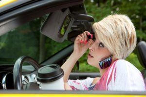 A women driving while distracted