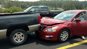 A truck and car in a fender bender